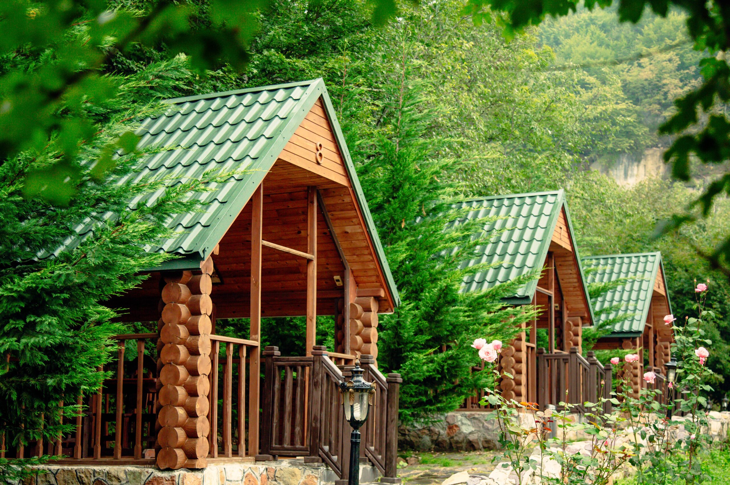 wooden arbors among trees and mountains